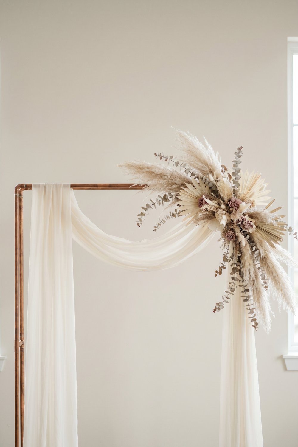 DIY wedding arch with copper pipe and pampas